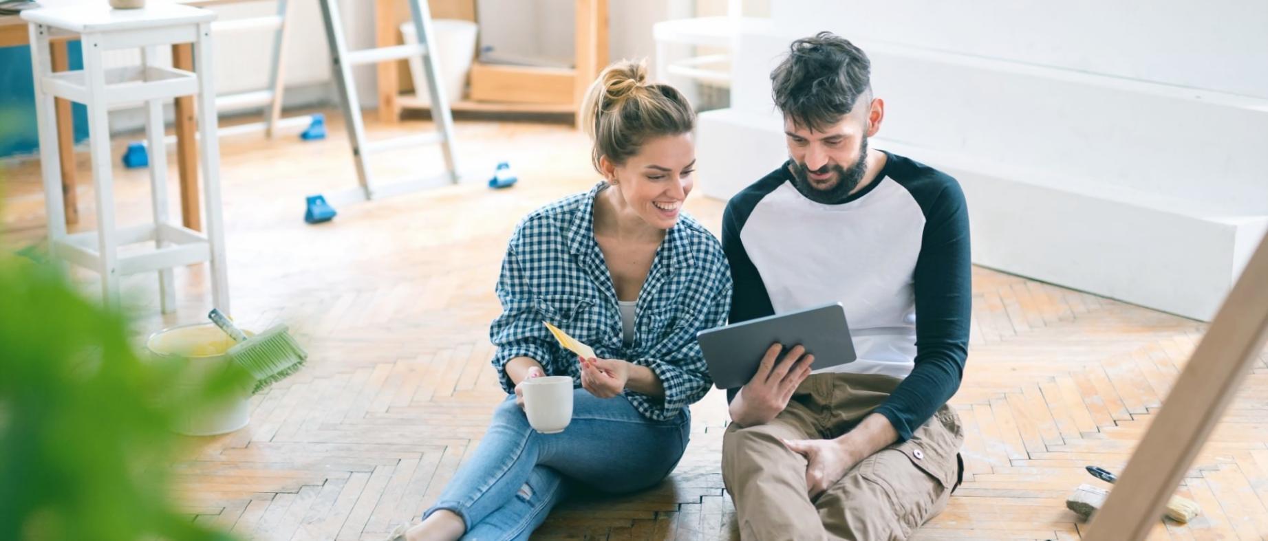 Financial analysis workspace showing industry documentation and market assessment materials spread across a working surface